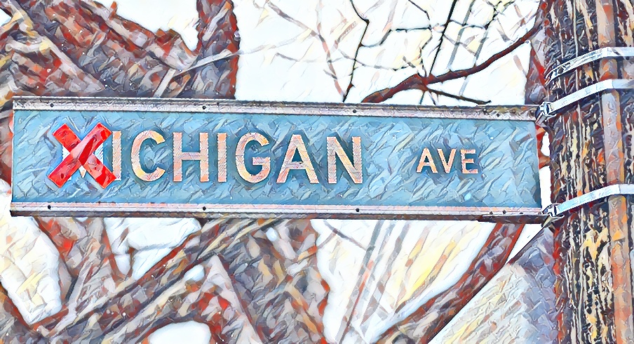  Michigan Avenue sign in the Harrison West neighborhood of Columbus has the M crossed out with a red X, an annual sign that the Ohio State - Michigan football game is approaching. This year's matchup, scheduled to be played on Dec. 12 at Ohio Stadium is possibly in doubt due to COVID-19